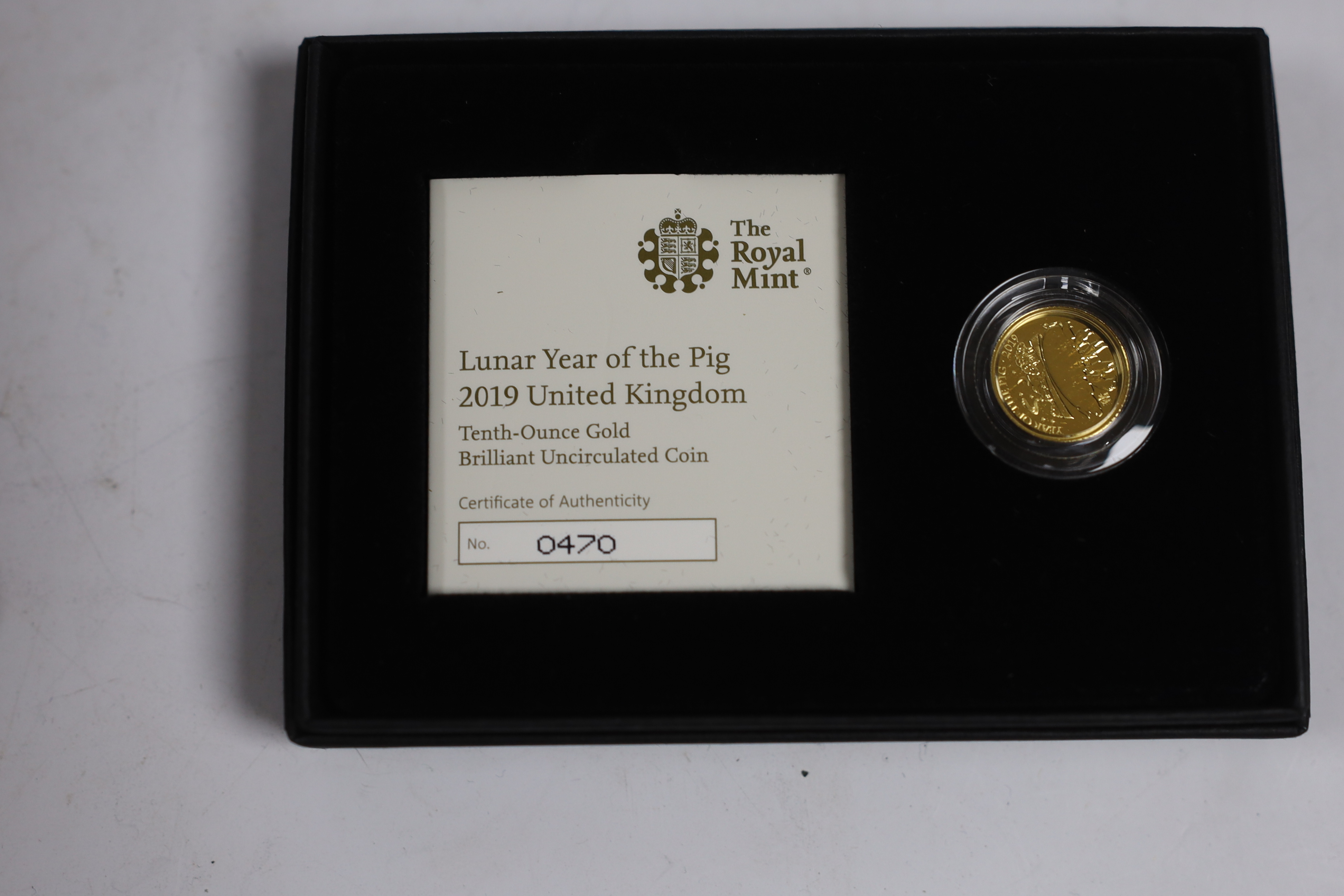 Royal Mint Lunar Year of the Pig, 2019, one tenth oz gold BUNC coin and one oz silver proof coin (two cases).